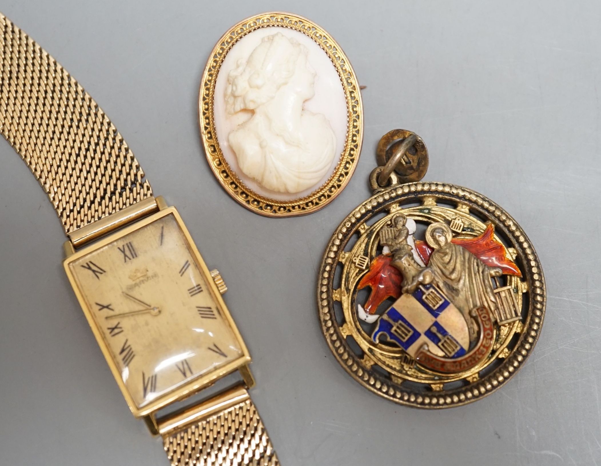 A gentleman's 18ct Marvin manual wind wrist watch, on a 9ct gold bracelet, gross 38.4 grams, a 9ct mounted oval cameo brooch cameo brooch and an enamelled gilt metal medallion.